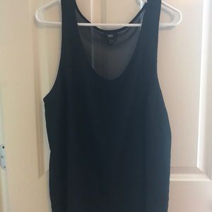 Sleeveless black tank. See through back